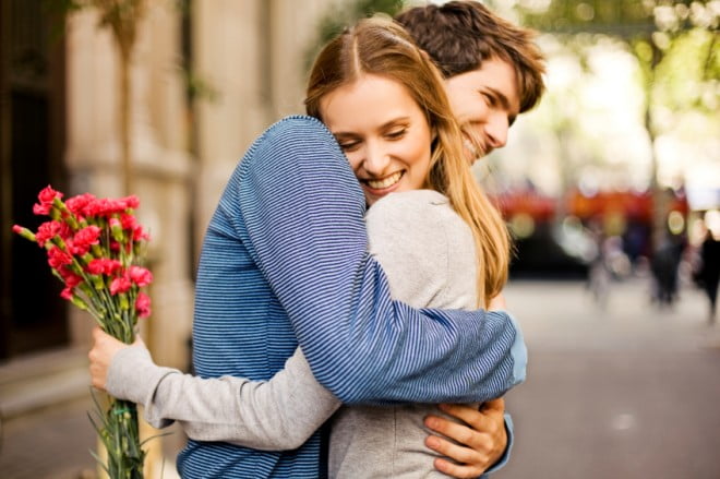 couple hugging cuddling flowers boyfriend girlfriend man w