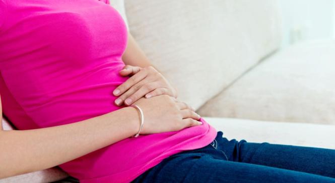 lady holding stomach in