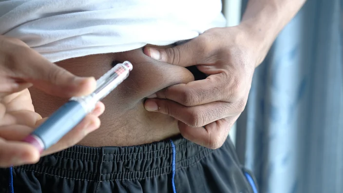 man closeup insulin injection stomach 1326112164